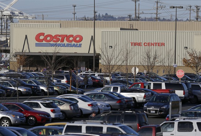  In this Tuesday, Nov. 24, 2015, file photo, cars fill the parking lot of a Costco store in Seattle. A California farm is recalling a vegetable mix believed to be the source of E.coli in Costco chicken salad that has been linked to an outbreak that has sickened several people in multiple states, the Food and Drug Administration said Thursday, Nov. 26.