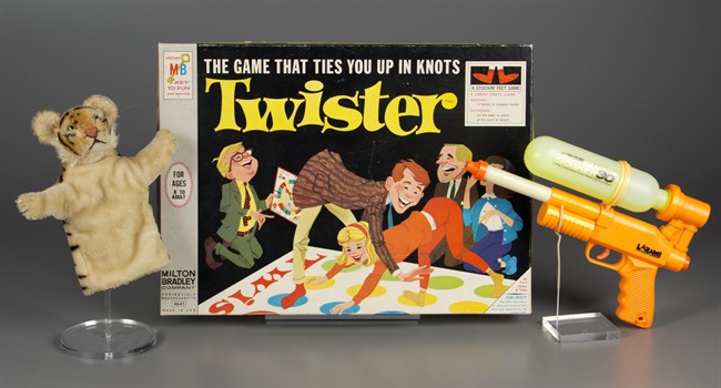 In this Sept. 24, 2015 photo provided by The Strong’s National Toy Hall of Fame in Rochester, N.Y., a puppet, the game of Twister and a Super Soaker are shown in a studio photo. On Thursday, Nov. 5, 2015, The Strong’s National Toy Hall of Fame announced that they have been chosen from a field of 12 finalists to be its 2015 inductees. 