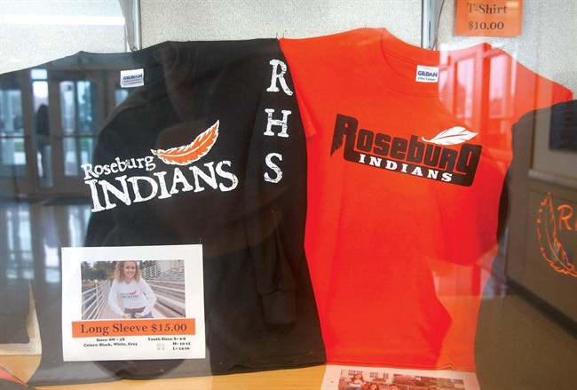This undated file photo shows shirts with the Roseburg High School mascot name and logo for sale in the entry area of the school in Roseburg. Ore.