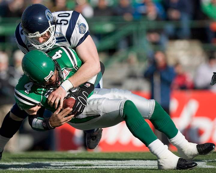 Toronto Argonauts Mike O'Shea sacks Saskatchewan Roughriders QB Kerry Joseph during a game in 2007. O’Shea is Toronto’s all-time leader in regular season and Grey Cup tackles.