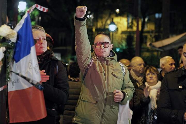 People gather at a memorial set-up near the Bataclan theatre in Paris, to pay respects to the victims of a series of deadly attacks on November 20, 2015 in Paris, France.