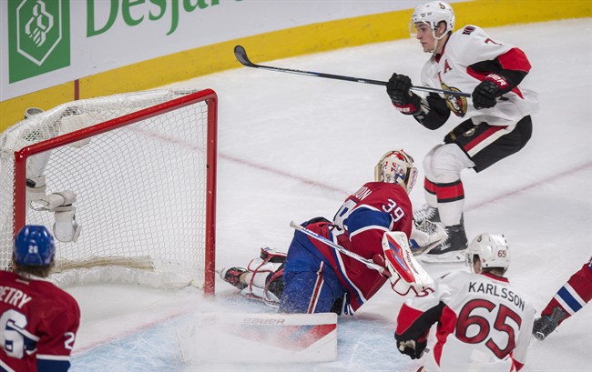 Ottawa Senators' Kyle Turris, right, scores on Montreal Canadiens' goalie Mike Condon during overtime.