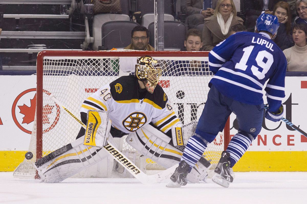 Boston Bruins goaltender Tuuka Rask (left) saves Toronto Maple Leafs Joffrey Lupul during a shoot out in NHL hockey action in Toronto on Monday, November 23, 2015.