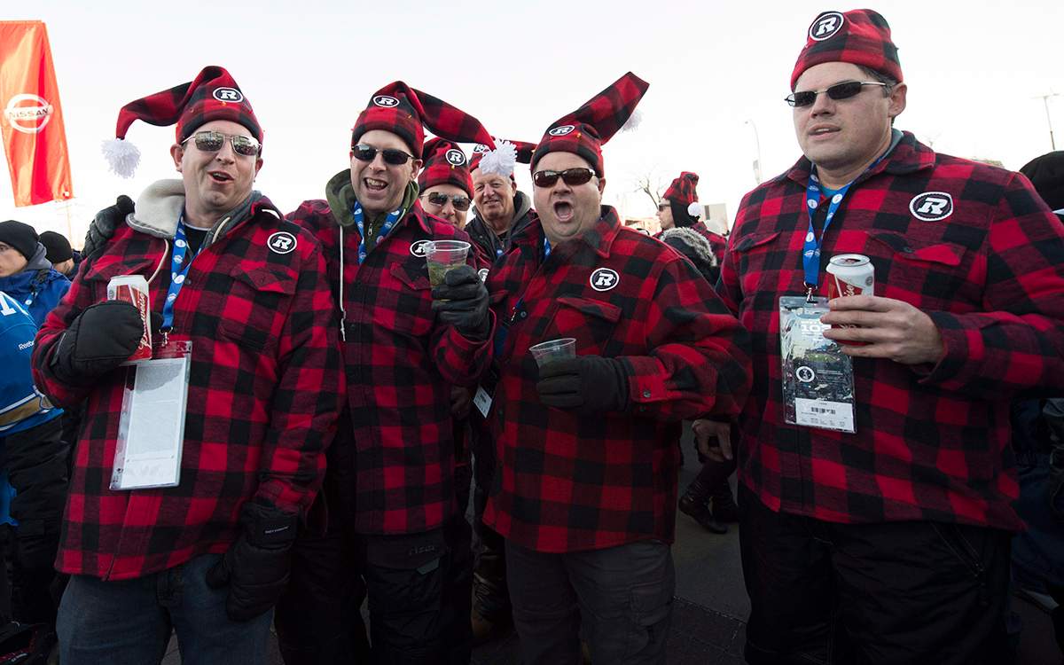 Football fans are seen prior to the 103rd Grey Cup between the Edmonton Eskimos and the Ottawa Redblacks in Winnipeg, Man., on Sunday, Nov. 29, 2015.