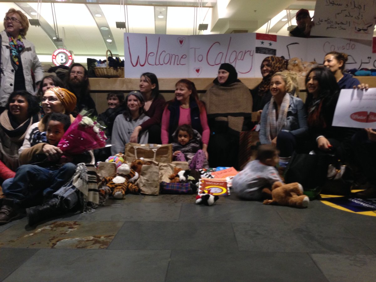 Syrian refugees arrive at Calgary International on Nov. 23, 2015.