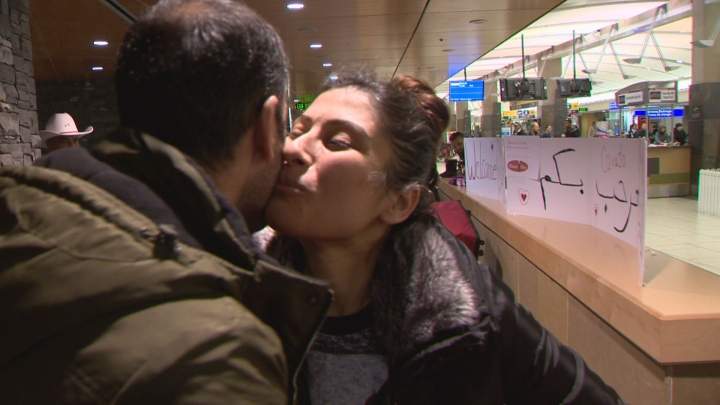 Ashour Esho greeted family as they arrived as some of Calgary’s first Syrian refugees Monday.