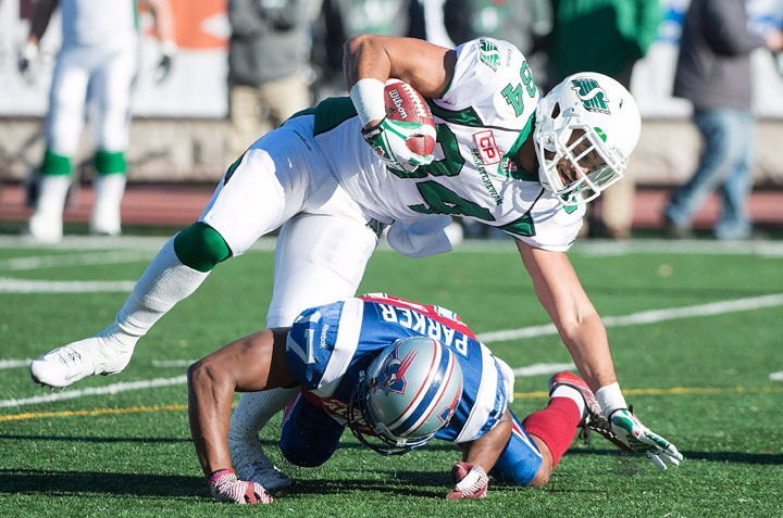 Montreal Alouettes' Billy Parker (17) tackles Saskatchewan Roughriders' Seydou Junior Haidara during first half CFL football action, in Montreal, on Sunday, Nov. 8, 2015.