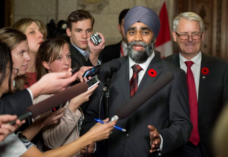 Minister of Defence Harjit Singh Sajjan speaks to reporters in the foyer on Parliament Hill after being sworn in earlier in the day, on Wednesday, Nov. 4, 2015, in Ottawa. 
