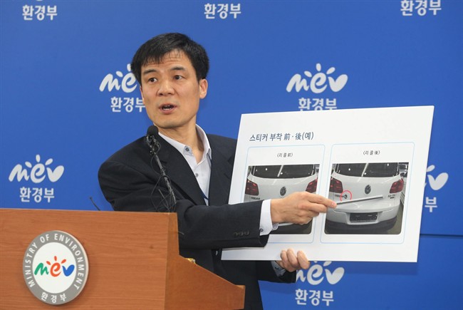 Hong Dong Gon, a director at the Ministry of Environment, speaks about investigation results of Volkswagen vehicle emissions during a press conference at the government complex in Sejong, South Korea, Thursday, Nov. 26, 2015. South Korea said Thursday it fined Volkswagen $12.3 million and ordered recalls of 125,522 diesel vehicles after the government found their emissions tests were rigged.(Bae Jae-man/Yonhap via AP).