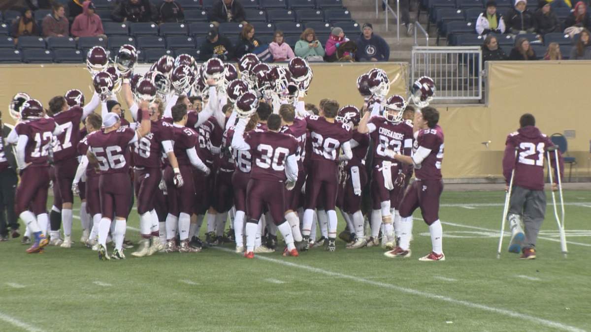 The St. Paul's Crusaders celebrate a 52-14 victory over the Garden City Fighting Gophers in the WHSFL semifinal.