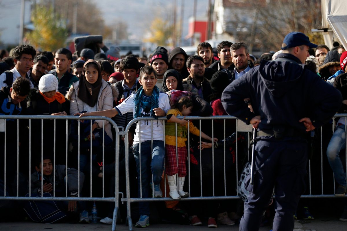 Migrants wait to register with the police at the refugee center in the southern Serbian town of Presevo, Monday, Nov. 16, 2015. 