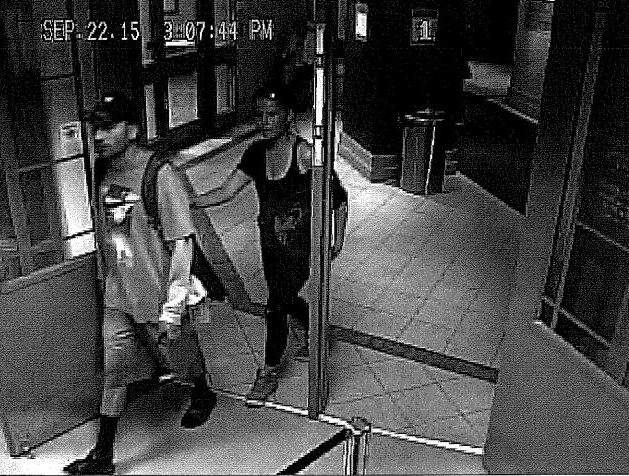 Officers are turning to the public for help tracking down a pair of suspects after a wallet was stolen on a transit bus last month.