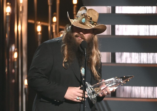 Chris Stapleton accepts the award for new artist of the year at the 49th annual CMA Awards at the Bridgestone Arena on Wednesday, Nov. 4, 2015, in Nashville, Tenn. 