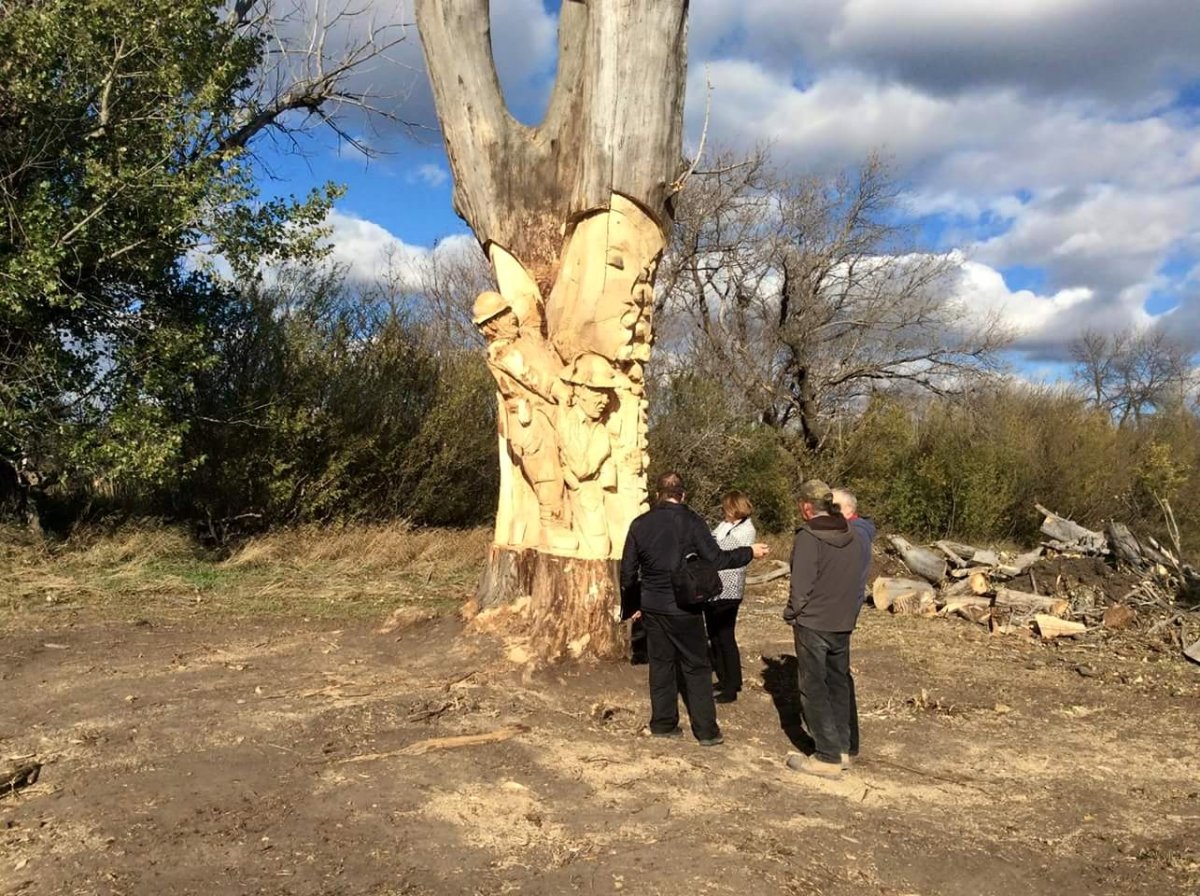 Visitors check out the work being on on the Estevan Soldiers' Tree.