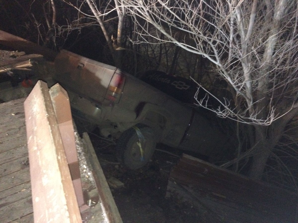 A truck driving north on Gateway Blvd. missed the turn onto Saskatchewan Drive and drove straight into the North Saskatchewan River valley, crashing through a lookout and bench in the process early Thursday morning. November 12, 2015.