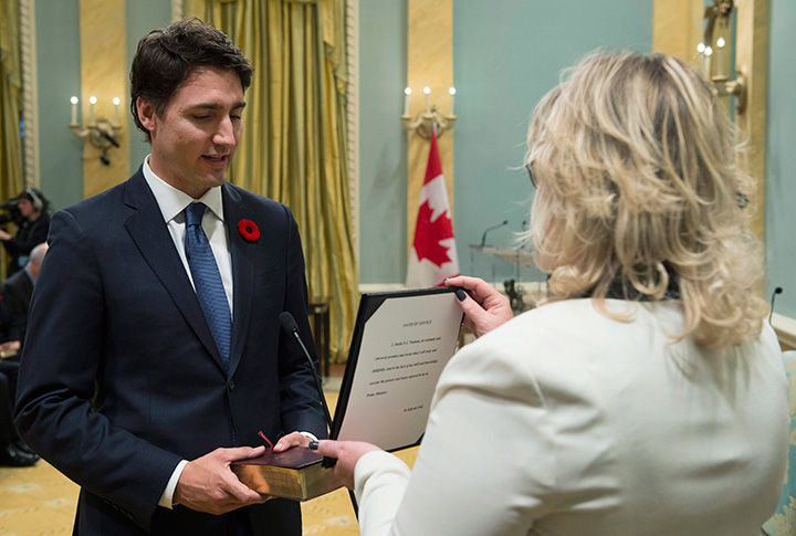 Justin Trudeau takes the oath of office as he is sworn in as prime minister at Rideau Hall in Ottawa on Wednesday, November 4, 2015. 
