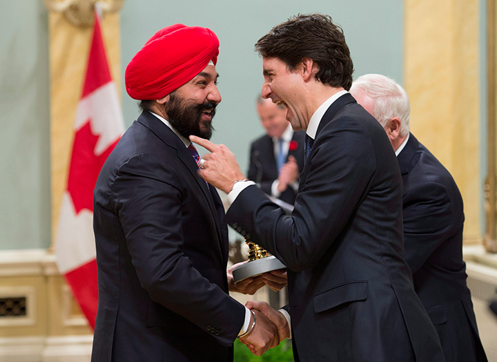 Prime Minister Justin Trudeau jokes with Minister of Innovation, Science and Economic Development Navdeep Singh Bains after he was presented with the Great Seal of Canada during ceremonies at Rideau Hall, Wednesday Nov.4, 2015 in Ottawa.