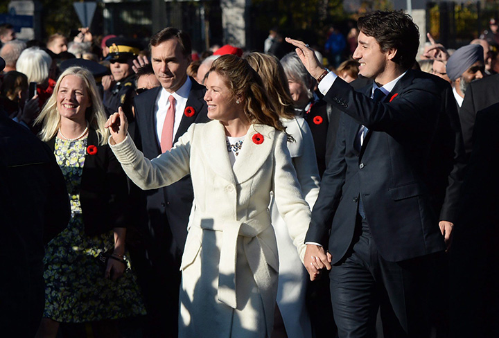 Prime Minister-designate Justin Trudeau and his wife Sophie Gregoire-Trudeau lead the new Liberal cabinet to Rideau Hall in Ottawa on Wednesday, Nov. 4, 2015.