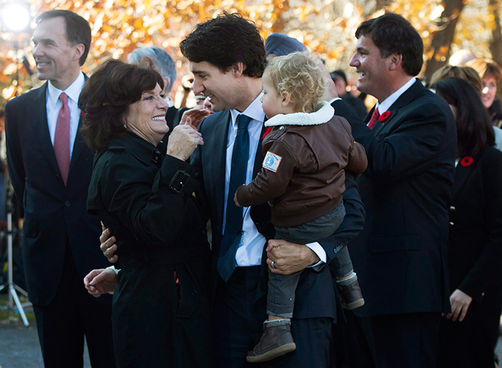 Prime Minister-designate Justin Trudeau holds his son Hadrian while hugging his mother Margaret outside Rideau Hall in Ottawa on Tuesday, November 4, 2015.