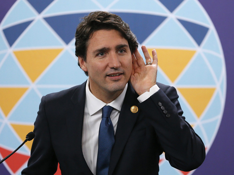Canadian Prime Minister Justin Trudeau listens to a question during a news conference following the Asia-Pacific Economic Cooperation Summit of Leaders Thursday, Nov. 19, 2015 in Manila, Philippines. Prime Minister Trudeau is embarking on his first foreign trip since becoming a Prime Minister.(AP Photo/Bullit Marquez).