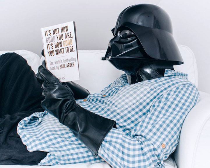 Darth Vader reading a book.