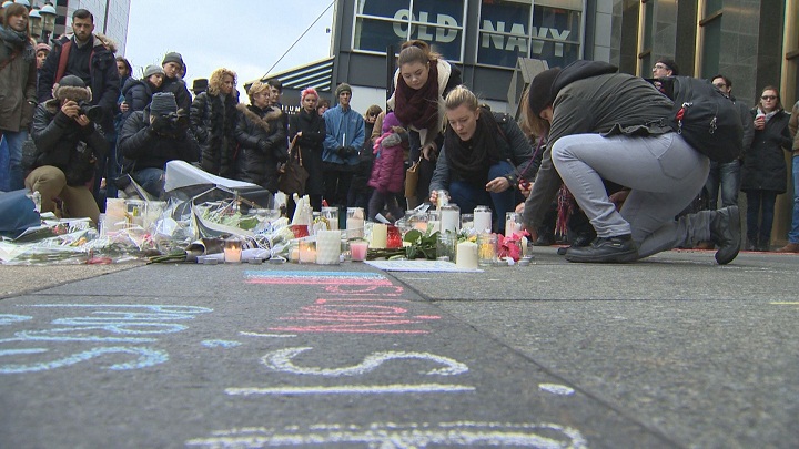 Supporters laid flowers, lit candles, wrote notes on the ground in memory of the victims of Friday’s attacks at a vigil Montreal, Saturday. Mississauga plans its own vigil for terror victims Sunday.