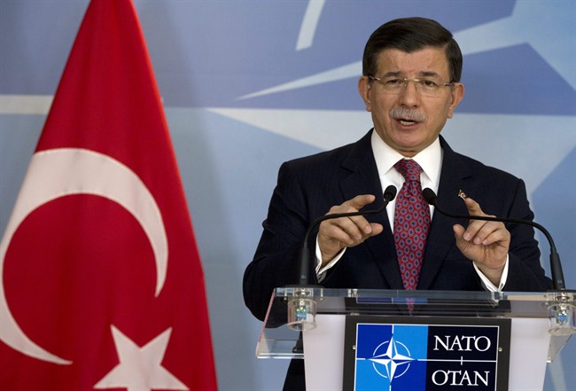 Turkish Prime Minister Ahmet Davutoglu speaks during a media conference at NATO headquarters in Brussels on Monday, Nov. 30, 2015. NATO Secretary General Jens Stoltenberg met with the Turkish prime minister on Monday to discuss the issue of a Russian warplane downed by a Turkish fighter jet at the border with Syria.