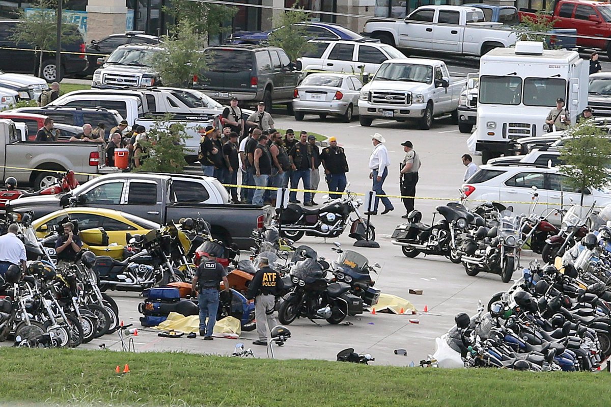  In this May 17, 2015 file photo, authorities investigate a shooting in the parking lot of the Twin Peaks restaurant, in Waco, Texas. 