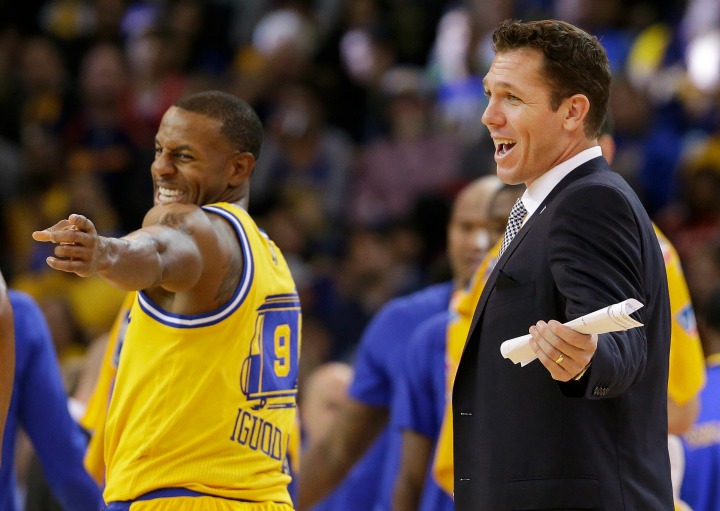 Golden State Warriors forward Andre Iguodala (9) and interim coach Luke Walton smile during the second half of an NBA basketball game against the Los Angeles Lakers in Oakland, Calif., Tuesday, Nov. 24, 2015. The Warriors won 111-77.