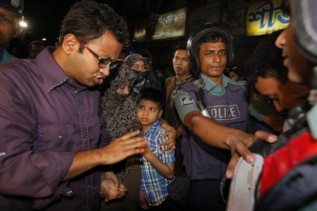 In this Saturday, Nov. 21, 2015 photo, family members arrive to meet Ali Ahsan Mohammad Mujahid, secretary general of the main Islamist party Jamaat-e-Islami, at the Central Jail in Dhaka, Bangladesh. 