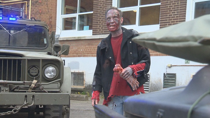 A zombie waits to infect his next victim at Macdonald High School. Saturday, Nov. 7, 2015.