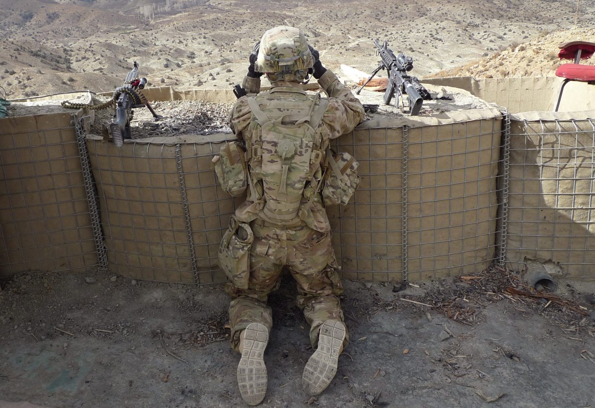 In this  2011 photo, a U.S. soldier serves as a lookout during a visit to an Afghan army outpost.