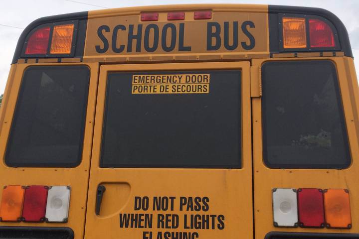 Alberta RCMP charge driver of car that collided with school bus.