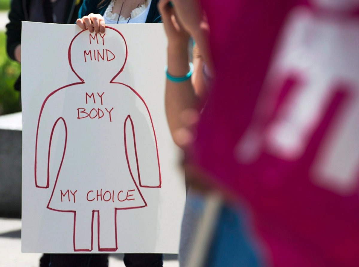 Protesters gather at Victoria Park on the one-year anniversary of the death of Dr. Henry Morgentaler in Halifax on Thursday, May 29, 2014 as they campaign for improved access to abortion in Canada. 