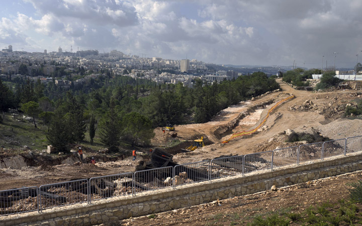 A view of infrastructure work underway in a neighborhood just north of Jerusalem, in an area that many consider the West Bank as it is built of pre-1967 Arab lands. Jerusalem is seen behind. 