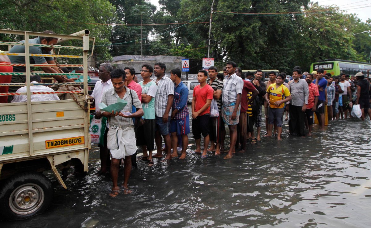 Flood affected people queue up for food in Chennai, India, Thursday, Dec. 3, 2015. 