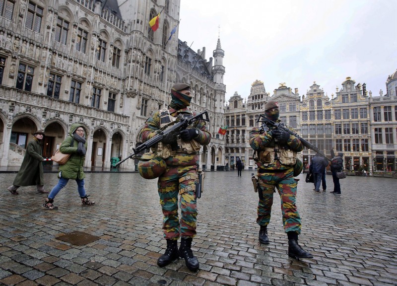 Police officers patrol the Grand Place in central Brussels, Belgium during lockdown on Tuesday, Nov. 24, 2015.