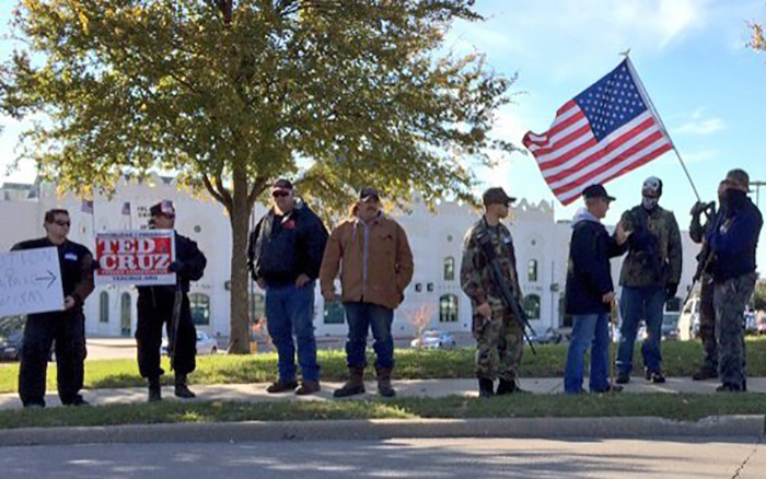 Armed demonstrators hold a protest outside the Islamic Center of Irving in the Dallas suburb of Irving, Texas. The movement has rallied against gun control efforts, patrolled the border with Mexico and recently begun confronting Muslim Americans.