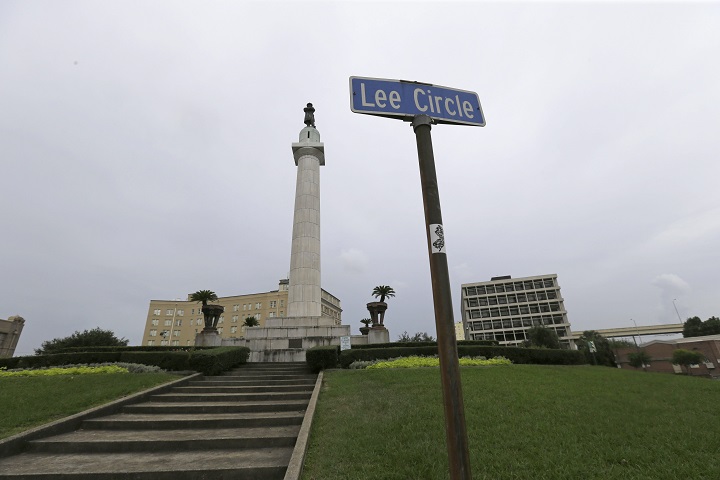 FILE-In this In this Sept. 2, 2015 file photo, the Robert E. Lee Monument is seen in Lee Circle in New Orleans. New Orleans is poised to make a sweeping break with its Confederate past as it contemplates removing prominent Confederate monuments now standing on some of its busiest streets. On Thursday, Dec. 17, 2015, the City Council is set to vote on an ordinance to remove four monuments. A majority of council members and the mayor support the move, which would be one of the strongest gestures yet by American city to sever ties with Confederate history. (AP Photo/Gerald Herbert, File).