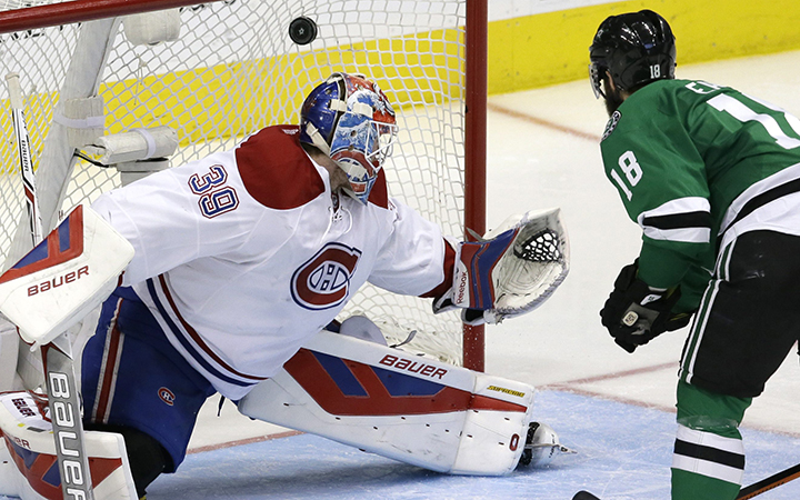 Dallas Stars right wing Patrick Eaves scores a goal against Montreal Canadiens goalie Mike Condon during the third period of an NHL hockey game Saturday, Dec. 19, 2015, in Dallas.