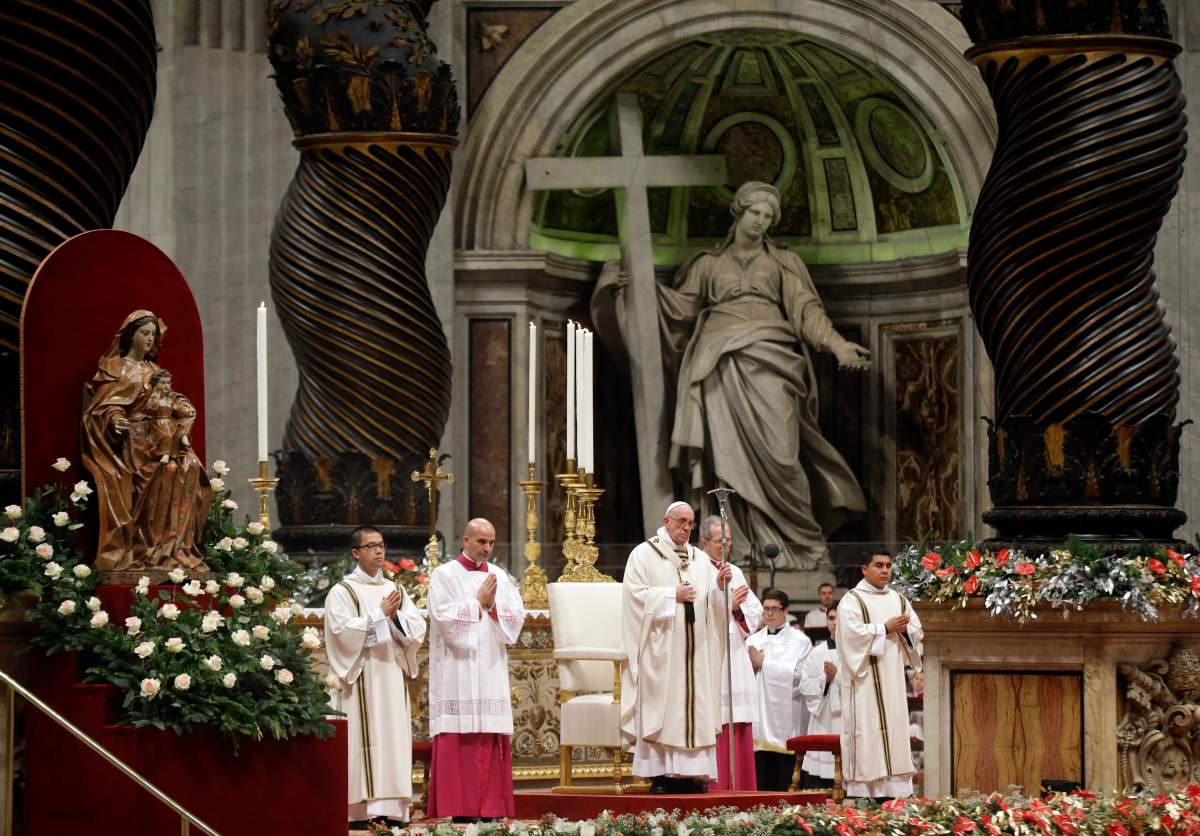 Pope Francis holds the pastoral staff as he celebrates the Christmas Eve Mass in St. Peter's Basilica at the Vatican, Thursday, Dec. 24, 2015. 