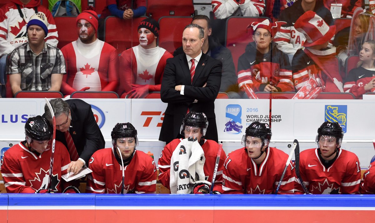 Canada's head coach Dave Lowry looks on as his team gives up a third goal to the United States during third period preliminary hockey action at the IIHF World Junior Championship in Helsinki, Finland, on Saturday, Dec. 26, 2015. The United States defeated Canada 4-2. 