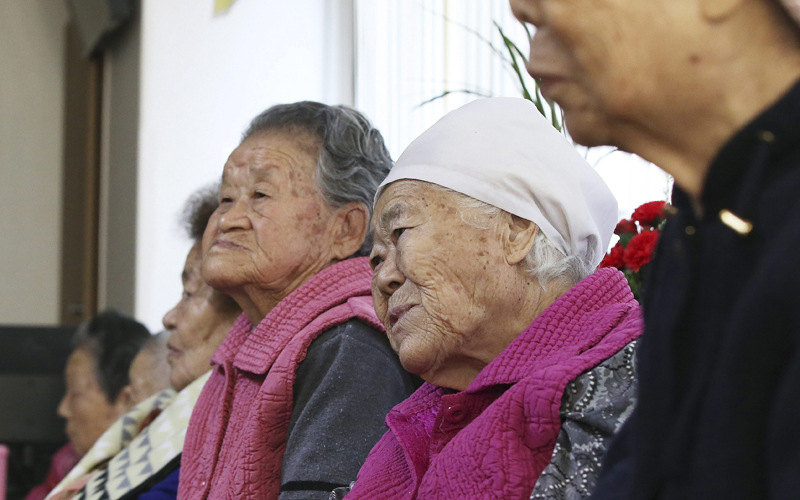 Former South Korean sex slaves, who were forced to serve for the Japanese Army during  the Second World War, wait for results of a meeting of South Korean and Japanese foreign ministers at the Nanumui Jip, The House of Sharing, in Gwangju, South Korea, Monday, Dec. 28, 2015. 