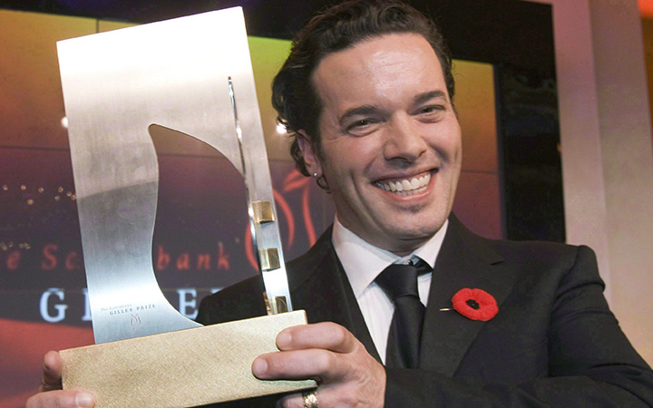 Joseph Boyden holds the Giller Prize after winning it in Toronto on Tuesday, Nov.11, 2008. Boyden, the award-winning author whose work vividly documents the complexity of Canada's indigenous history, is among the latest appointments to the Order of Canada in a year when aboriginal issues have dominated the national agenda.