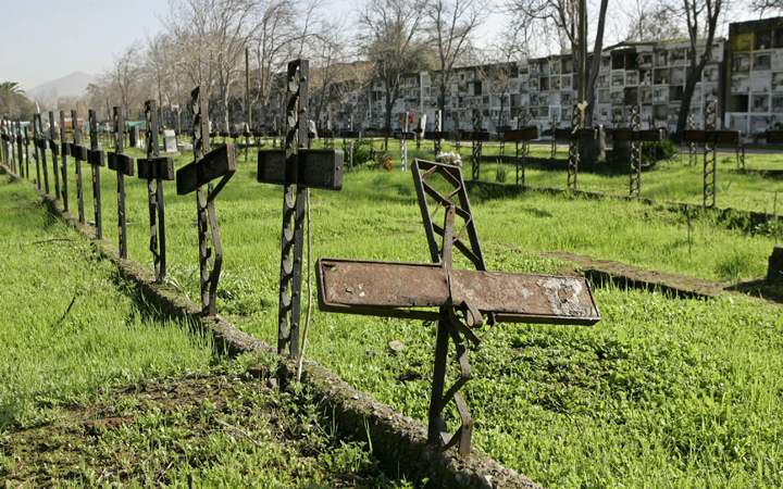 Rusted crosses mark the plots of unidentified persons in Patio 29, the notorious mass grave from Chile's "dirty war,"  in Santiago, Chile, July, 18, 2006.  