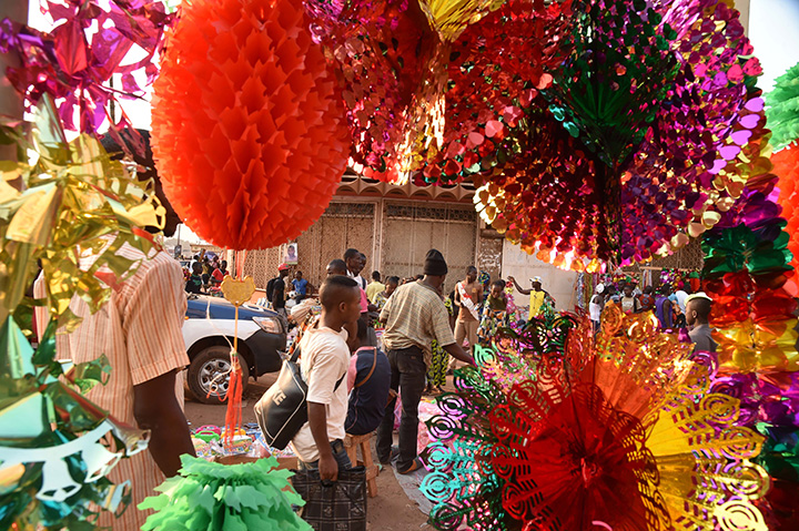 People shop for their last minute Christmas decorations at a market in Bangui, on December 23, 2015. The Somali government has banned Christmas and New Year’s celebrations in the predominantly Muslim country over fears Islamic extremists might exploit the celebration to attack non-Muslims.   
