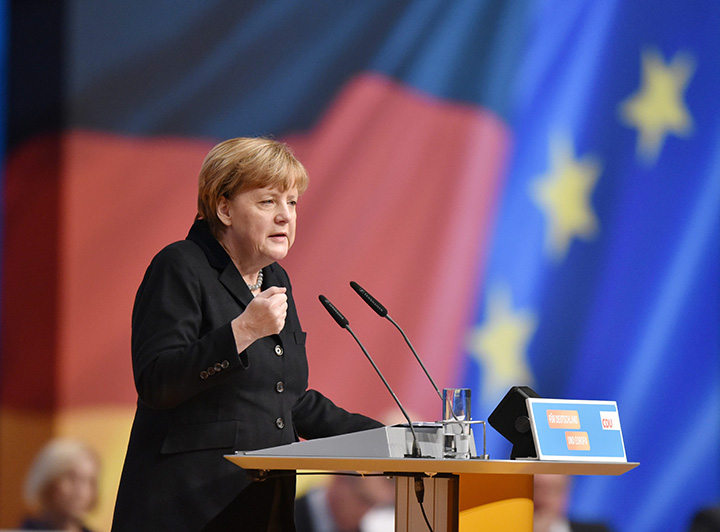 German Chancellor Angela Merkel speaks to delegates of her Christian Democratic Party in Karlsruhe, Germany, Monday Dec. 14, 2015. 