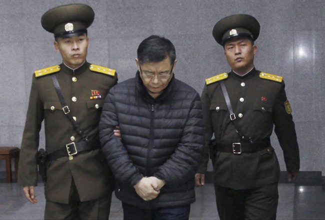 Hyeon Soo Lim, center, who pastors the Light Korean Presbyterian Church in Toronto, is escorted to his sentencing in Pyongyang, North Korea, Wednesday, Dec. 16, 2015. 
