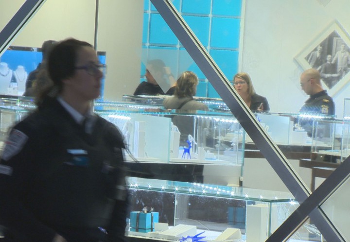 Laval police speak to witnesses after a robbery at Birks Jewellery in Carrefour Laval, Wednesday, December 23, 2015.