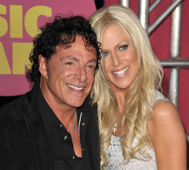  In this June 6, 2012, file photo, Neal Schon, left, and Michaele Salahi arrive at the CMT Music Awards in Nashville, Tenn.
